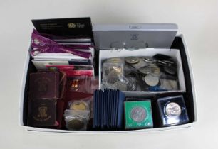 A collection commemorative coin sets and crowns to include a Royal Mint UK Brilliant Uncirculated