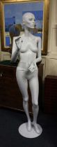 A vintage female mannequin on metal stand 175cm high