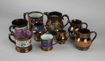 Six Victorian copper lustre jugs and four lustre mugs