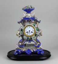 A 19th century French porcelain mantle clock, the scrolling case with two birds and flower encrusted
