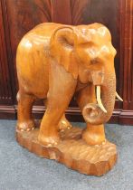 A large carved wood model of an elephant 70cm high
