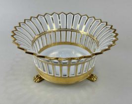 A French Paris porcelain corbeille in the Empire style the flared pierced circular form with heavy