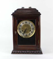 A 20th century mahogany cased bracket clock with egg and dart carved border to base, circular dial