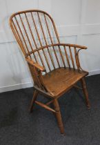 A Windsor armchair with spindle back, solid seat on turned legs
