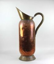 A large copper and brass flagon stick stand 75cm high