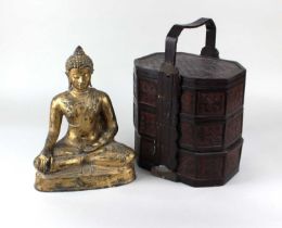 A gilt and terracotta model of a seated Buddha 26cm high, and a Chinese rattan three tier lunchbox