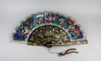 A 19th century Chinese painted paper fan decorated with figures with ivory faces on gilt lacquered