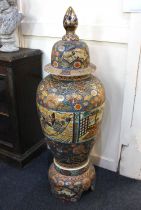 A large Japanese Satsuma floor vase and cover on stand, with figural border, floral and foliate gilt