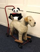 A toy push-along dog and a Wendy Boston plush panda bear