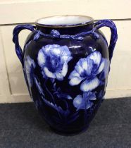 A Victorian Imperial ware large blue glazed two-handled vase decorated with poppies 57cm high