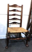 A ladder back chair with rush seat on cabriole front legs (a/f)