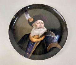 A 19th century continental porcelain plaque the lightly dished circular form hand painted with a