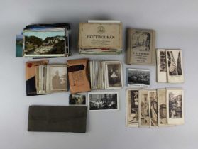 A collection of postcards, mostly scenic views in black and white and in colour, together with a