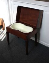 A Victorian mahogany bidet / stool lifting rectangular top with fitted shaped bidet bowl, on tapered