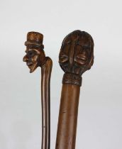 A Greek Kepkypa walking stick with four carved faces to handle 88cm, and a thin stick the handle