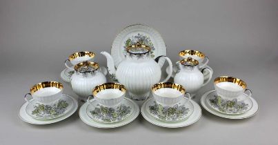 A Lomonosov porcelain tea set comprising teapot, milk jug, sugar bowl and cover, bowl, six small