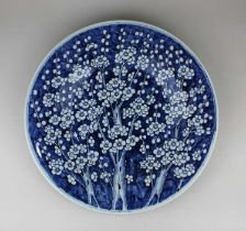 A Chinese blue and white porcelain charger decorated with prunus blossom 41cm