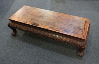 A Chinese carved hardwood opium table on cabriole legs to claw feet 113cm
