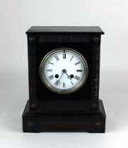 A black painted mantle clock, the white enamel dial with Roman numerals, the movement striking on
