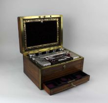 A Victorian rosewood and brass bound dressing case stamped S Mordan & Co with engraved cartouche '