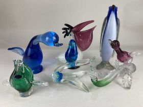 A collection of six various coloured glass models of birds, to include a pelican, 24cm high, and a