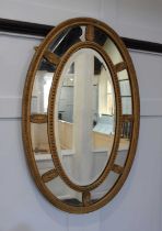A gilt wood and gesso oval mirror 77cm