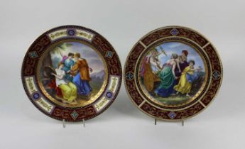 A pair of Vienna porcelain cabinet plates each decorated with a classical scene within a scrolling