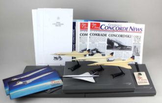 A collection of Concorde memorabilia to include four models (one Corgi), Flights of Fancy Goodwood