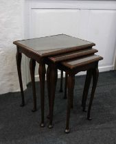 A nest of three walnut side tables with rectangular burr tops on cabriole legs, 49cm