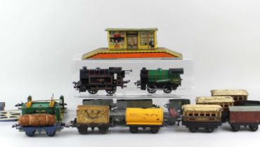 A collection of Hornby 0 gauge tinplate clockwork model railway to include a Type 40 locomotive with