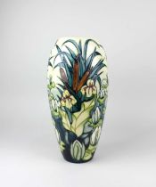 A Moorcroft pottery 'Lamia' pattern baluster vase decorated with bullrushes, water lilies and