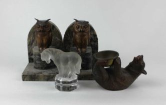 A carved wood Black Forest bear holding a brass pot 8.5cm, a Goebel frosted and clear glass