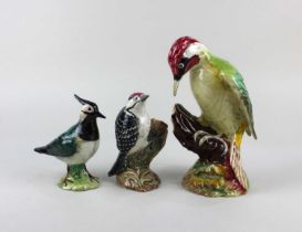 Three Beswick porcelain models of birds comprising 1218 Woodpecker 23cm high, 2420 Lesser Spotted