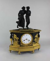 A French matt black and polished gilt bronze mantle clock with figures of 'Paul and Virginie' to the