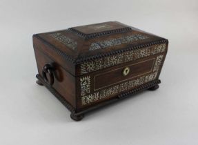 A Victorian rosewood and mother of pearl inlaid sewing box with gilt tooled fitted interior