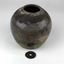 A glazed pottery vase with faint brushstrokes, possibly Chinese 16.5cm and a Chinese coin (a/f)