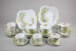 A Shelley porcelain 'Daffodil Time' pattern part tea service comprising two platters, twelve small