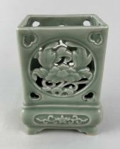 A Chinese reticulated celadon glazed vase the rectangular upper section pierced to opposing sides