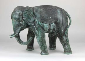 A green patinated bronze model of an elephant purchased in Vietnam 38cm high