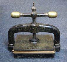 A cast iron book binding press with brass handles, size of press plate 25cm by 30cm