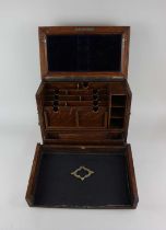 An oak writing box with hinged panel top and front enclosing fitted interior 37cm (a/f - one