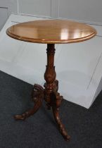 A mahogany circular side table with carved support and tripod base, 55cm