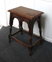 An oak rectangular stool with drop finial frieze on sloping block and turned legs, 50cm