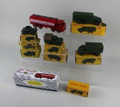 Eight boxed Dinky Toys comprising 641 Army 1-Ton Cargo Truck, 643 Army Water Tanker, 677 Armoured