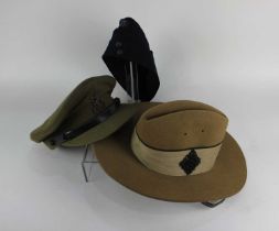 A Ghurka hat with small metal badge and bush hat from the 9th Ghurka rifles c1943-46 and a