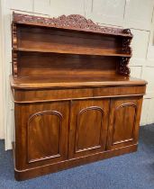 A good quality Victorian mahogany sideboard, having a raised back of 2 open shelves with pierced