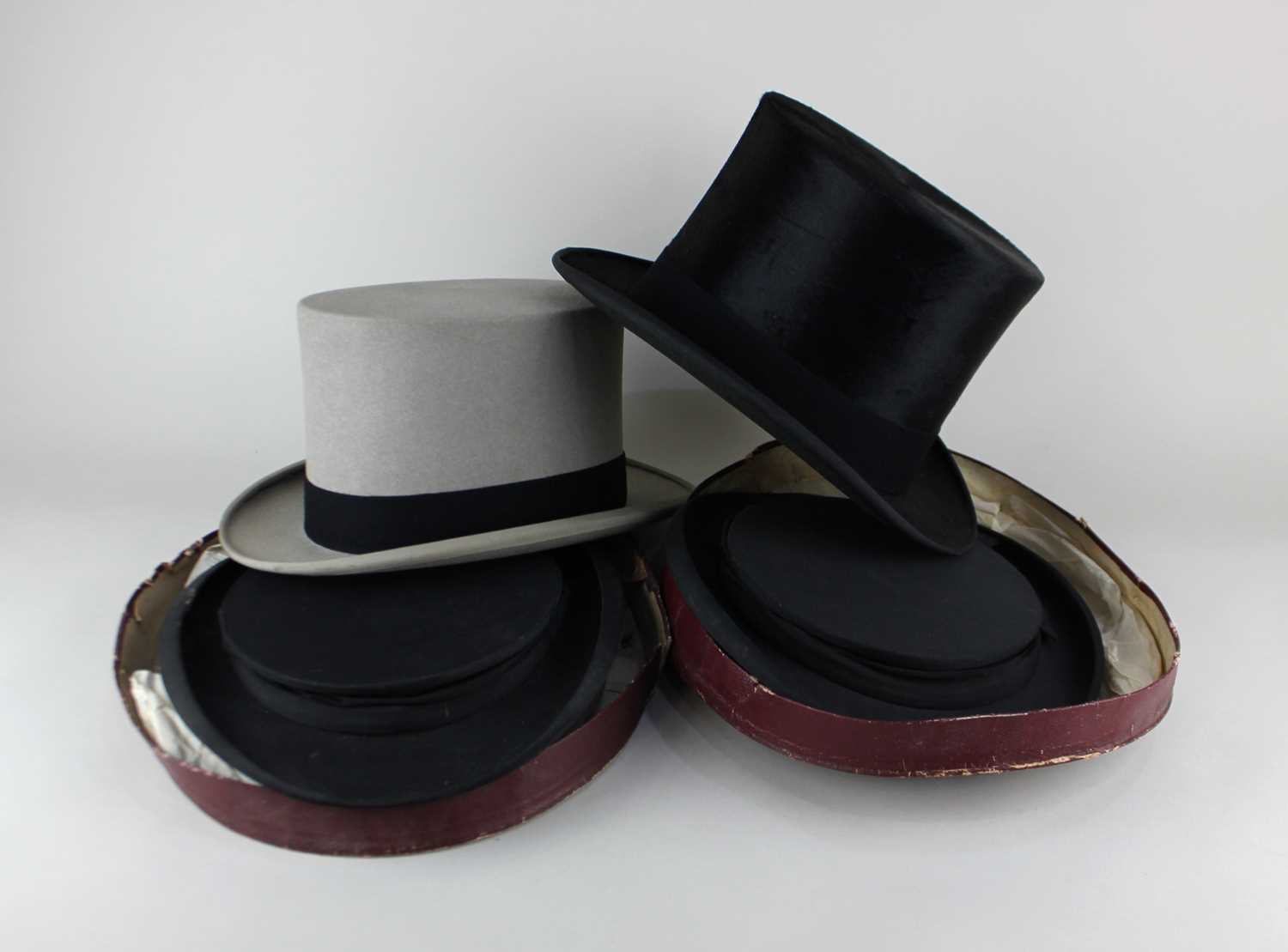 A black silk top hat by Thomas & Stone Hat & Cap Makers Jermyn Street, London, and a pale grey top