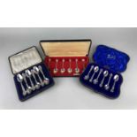 A cased set of Queen Elizabeth II royal commemorative tea spoons the terminals cast with