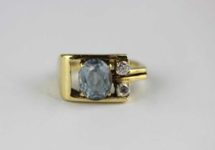 A gold, synthetic blue and colourless gem set three stone ring, detailed indistinctly to the