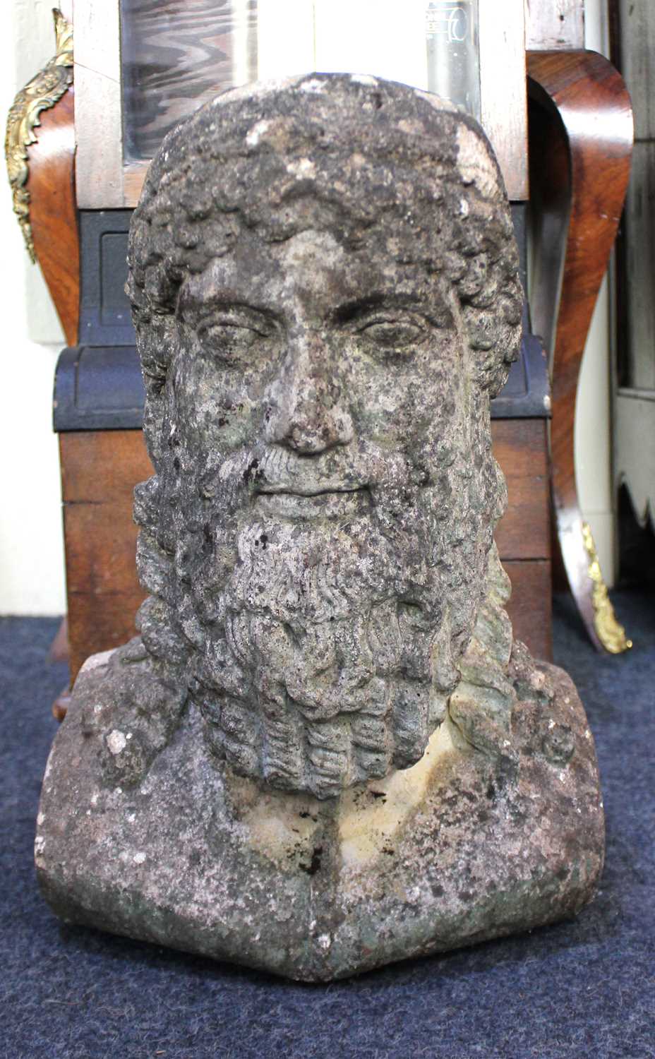 A bust of a Greco/Roman male figure, being of nicely weathered reconstituted stone, 20th century,